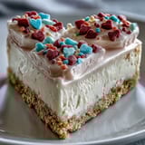 Festive conversation heart candies and pink whipped frosting top this sweet American dessert, perfect for a party.