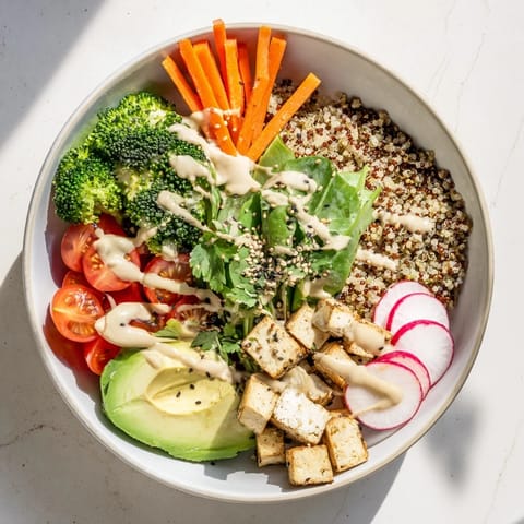 Healthy Buddha Bowl topped with steamed broccoli, shredded carrots, and pickled onions, served as a vibrant main dish.